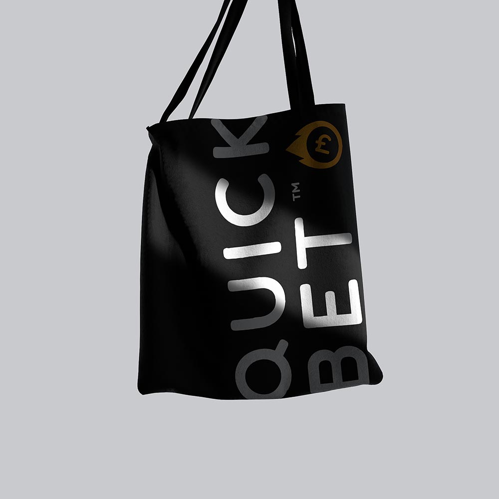 QuickBet.com's logo on a merchandise tote bag